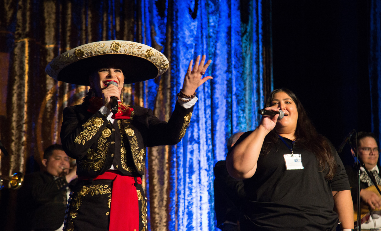 United Way of Central Eastern California President & CEO Mari Pérez-Dowling and United Way of Central Eastern California staff member Amelia Dias Cabrera performing for attendees